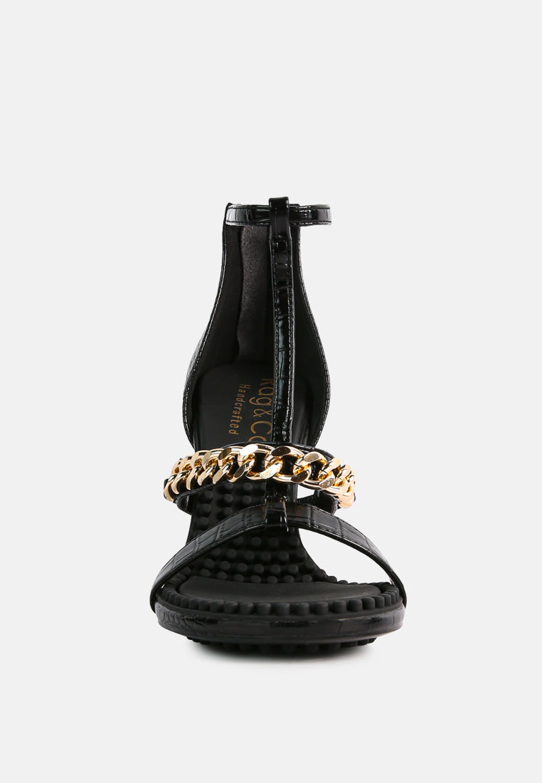 Dakota Metal Chain Mid Heel Sandals featuring a stylish T-strap design with a metal chain detail, available in black, white, and latte colors.