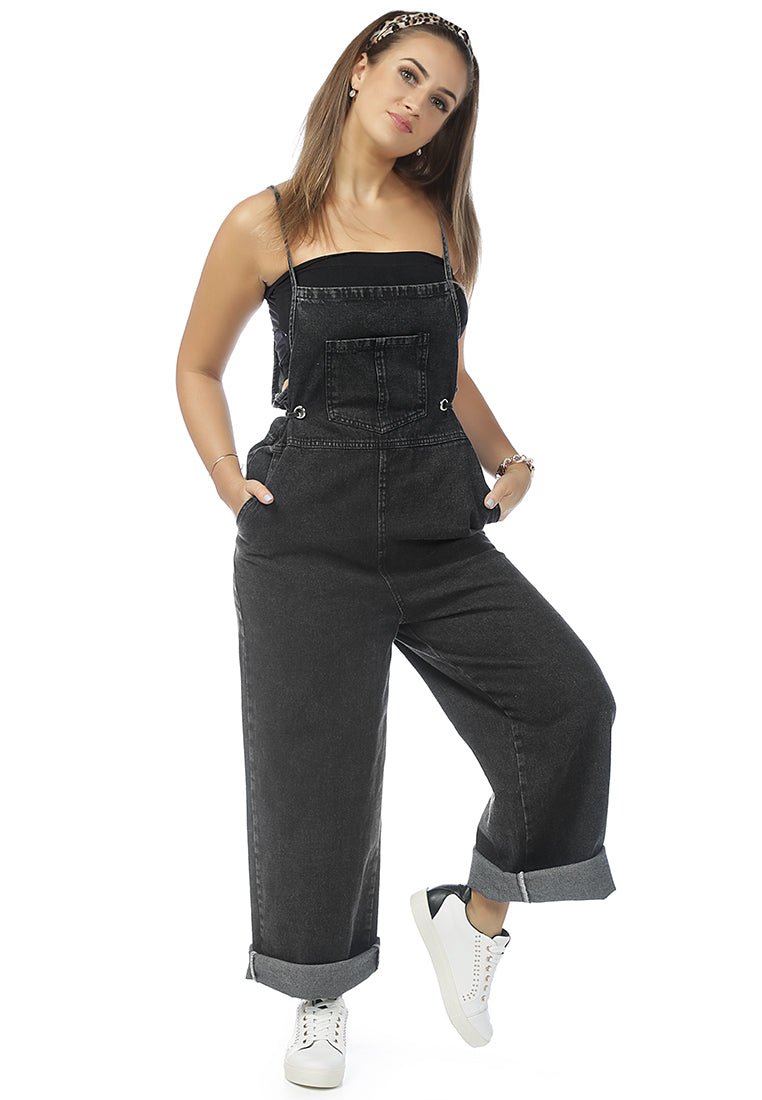 Deep blue denim tie-up spaghetti jumpsuit with front patch pocket and adjustable waist drawstring, perfect for casual outings.