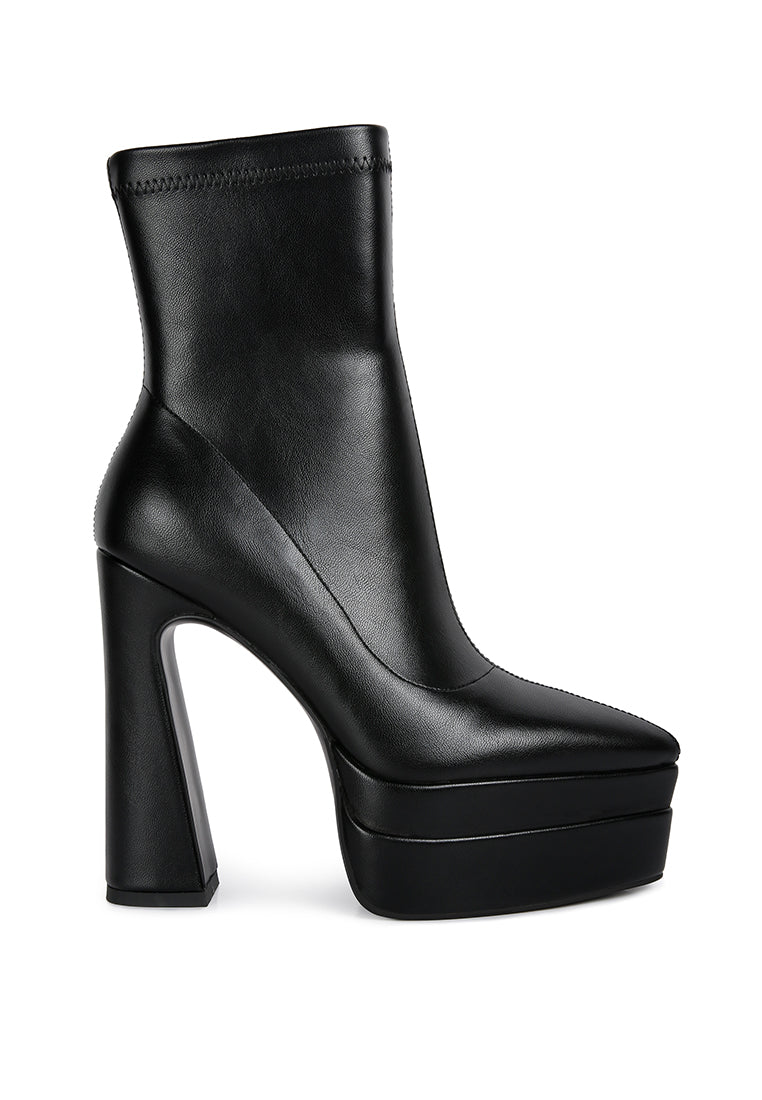 Dextra High Platform Ankle Boots featuring a closed pointed toe, faux leather material, and chunky block heels with a side zipper.