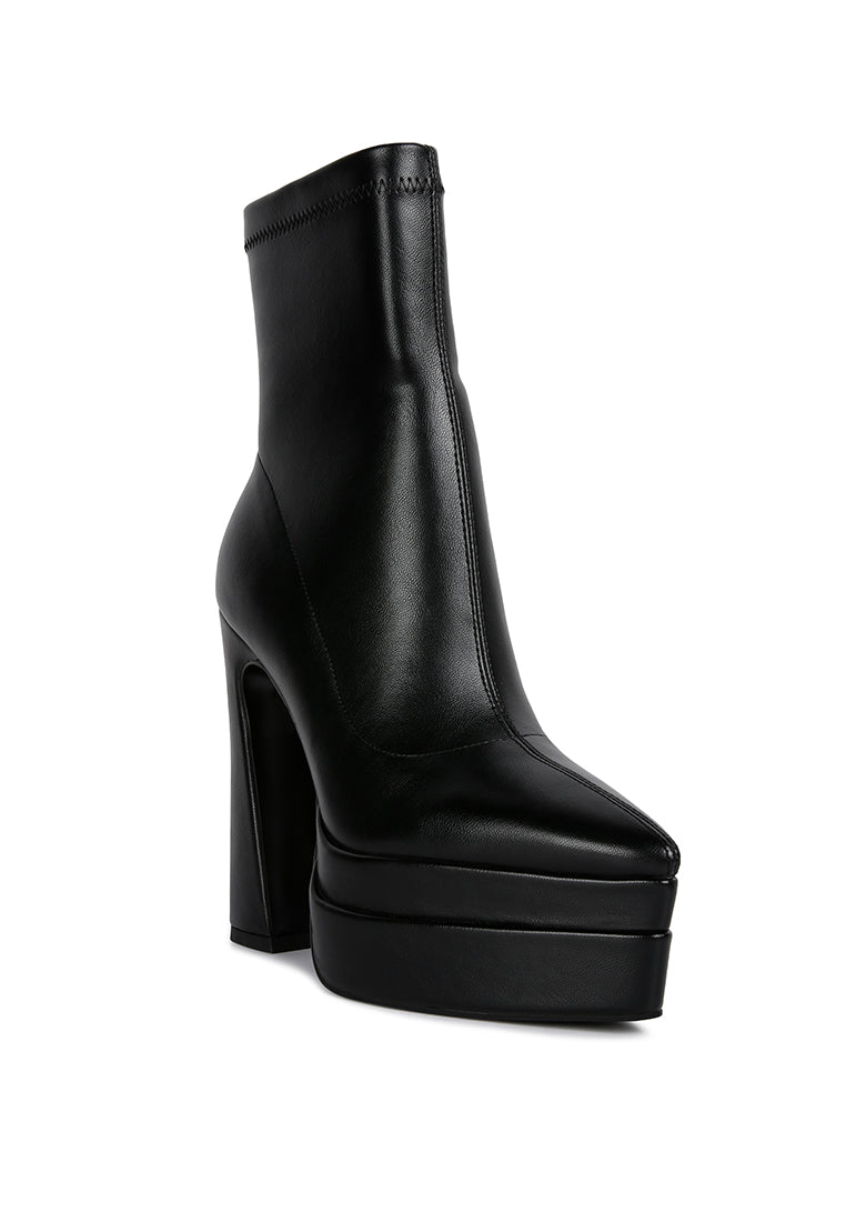 Dextra High Platform Ankle Boots featuring a closed pointed toe, faux leather material, and chunky block heels with a side zipper.