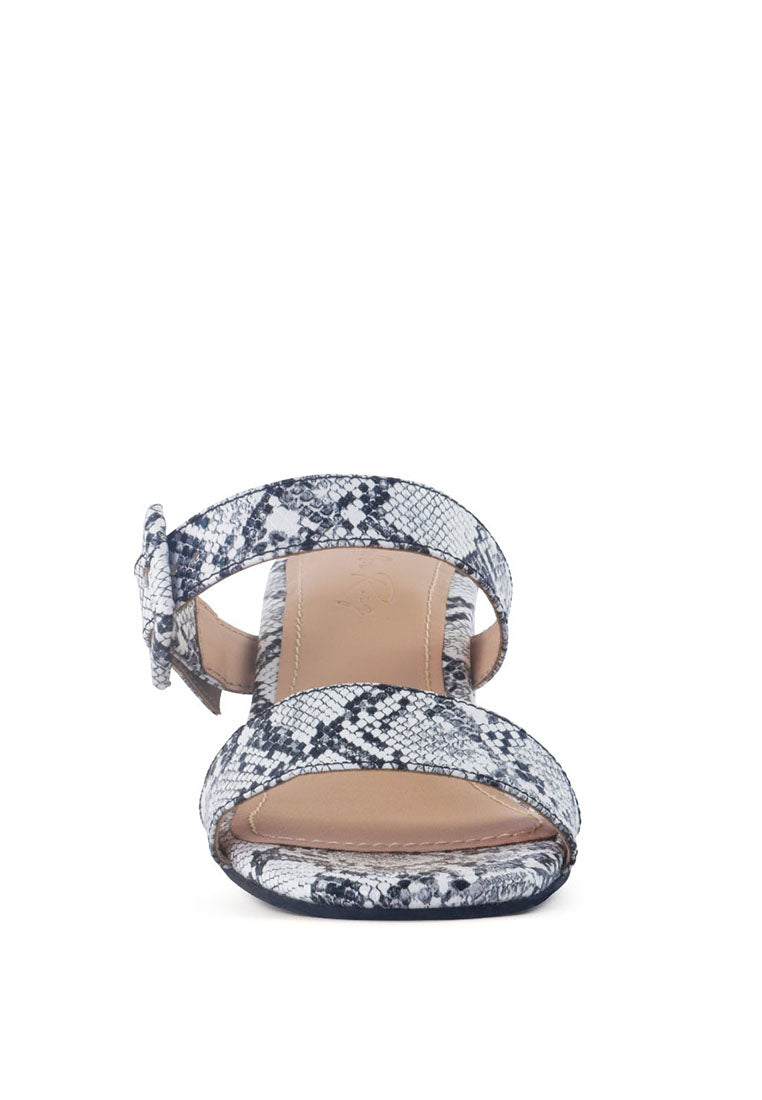 Doodle Animal Print Block Heel Sandals featuring a stylish design with metallic finish and buckle details.