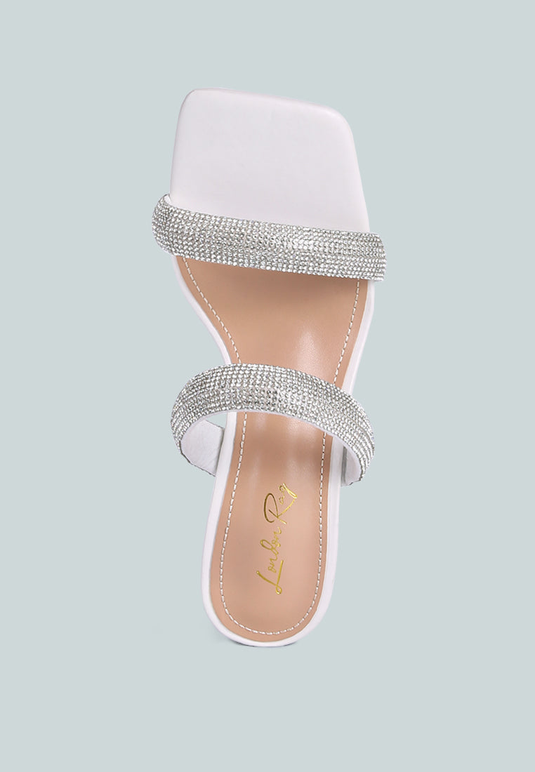 Dolls Rhinestone Embellished Slip On Sandals featuring clear heels and sparkling rhinestone straps, perfect for weddings and parties.