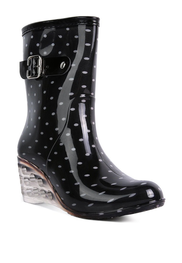 Drench Clear Wedge Rainboots featuring a clear wedge heel, side zipper, and buckle detail, perfect for stylish monsoon wear.