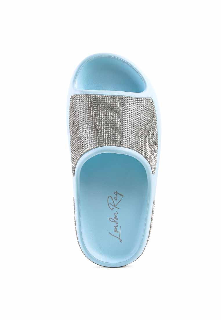 Dumba Diamante Pool Sliders showcasing shiny diamante details and a comfortable molded footbed, perfect for summer wear.