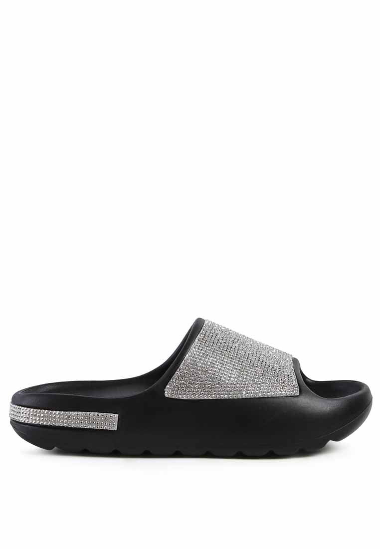 Dumba Diamante Pool Sliders showcasing shiny diamante details and a comfortable molded footbed, perfect for summer wear.