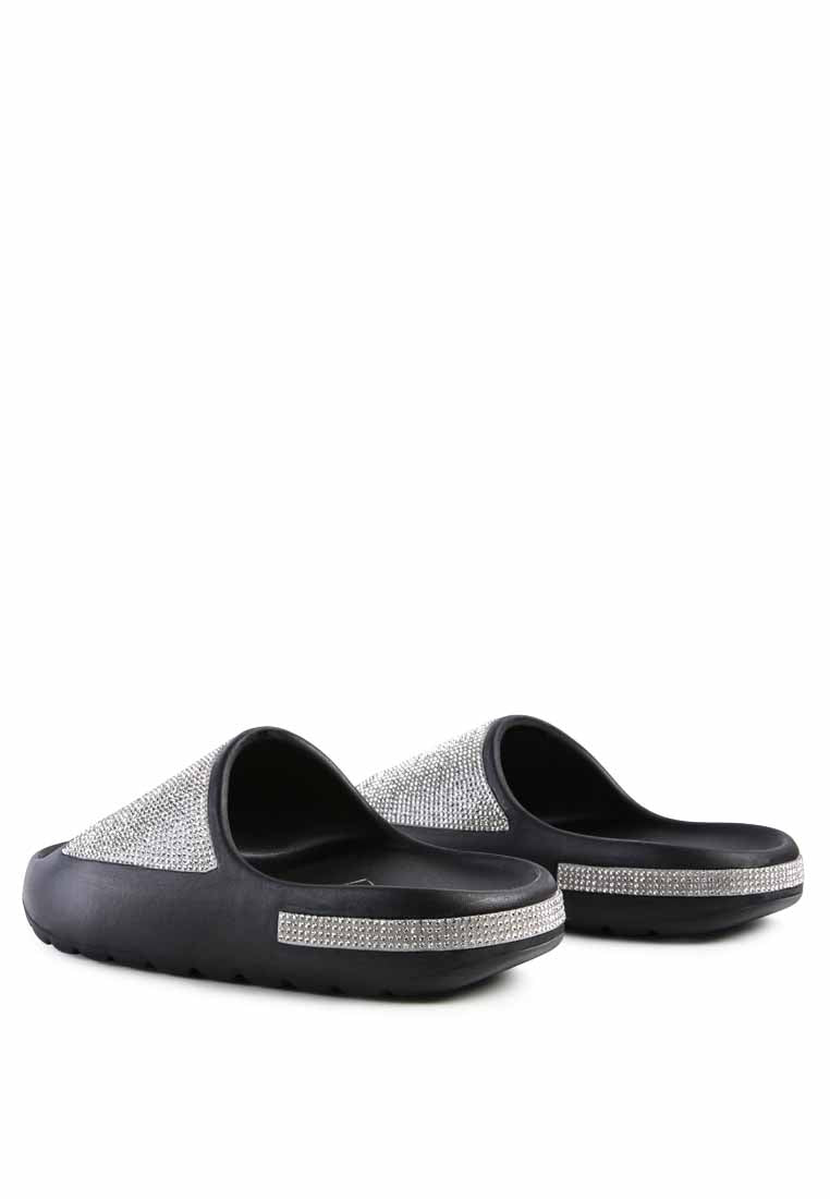 Dumba Diamante Pool Sliders showcasing shiny diamante details and a comfortable molded footbed, perfect for summer wear.