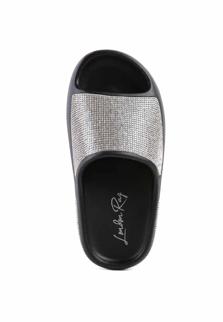 Dumba Diamante Pool Sliders showcasing shiny diamante details and a comfortable molded footbed, perfect for summer wear.