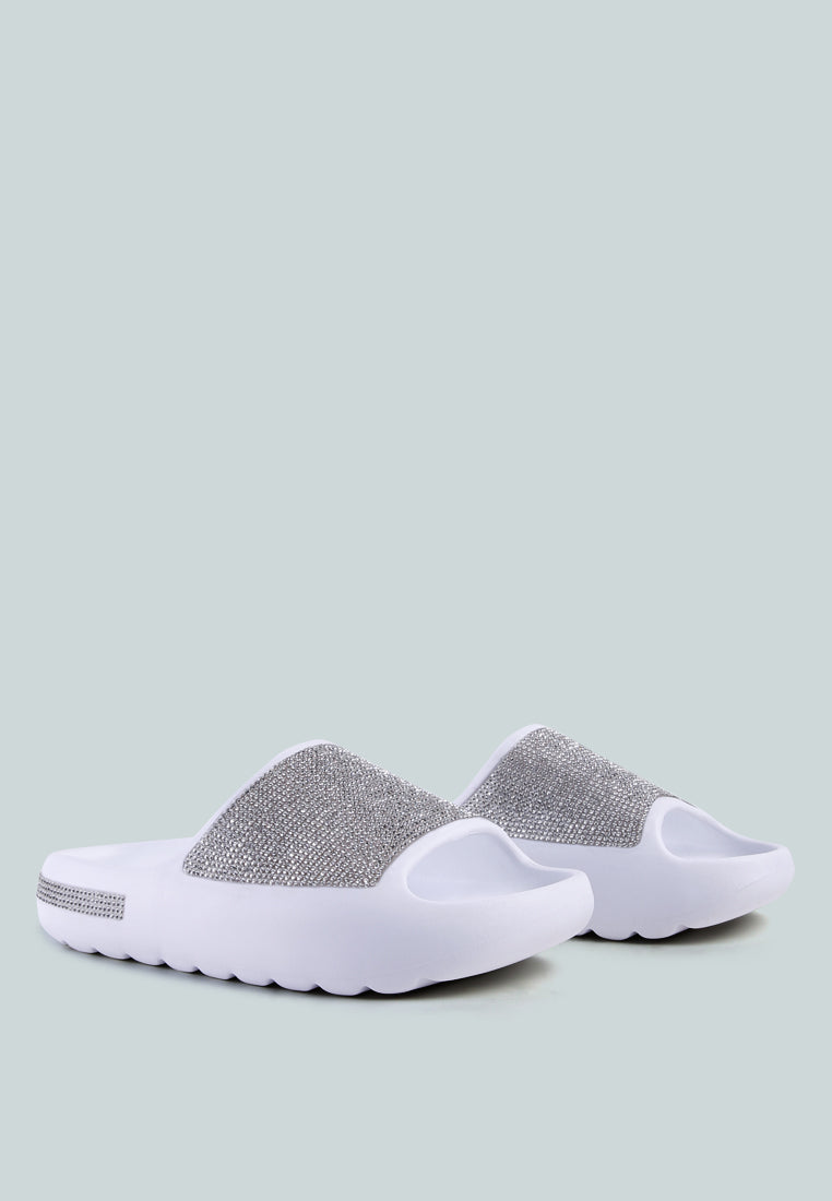 Dumba Diamante Pool Sliders showcasing shiny diamante details and a comfortable molded footbed, perfect for summer wear.