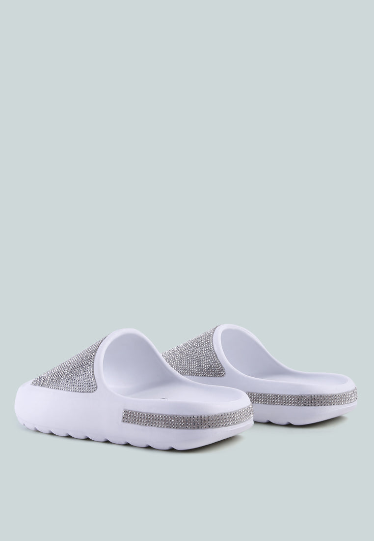 Dumba Diamante Pool Sliders showcasing shiny diamante details and a comfortable molded footbed, perfect for summer wear.