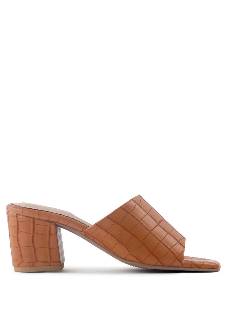 Dumpllin Croco Slip-On Block Heel Sandals featuring a stylish croc pattern and mid block heel design.