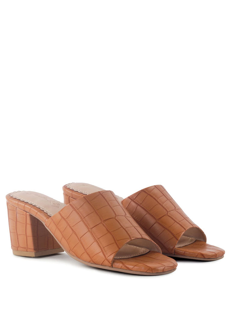 Dumpllin Croco Slip-On Block Heel Sandals featuring a stylish croc pattern and mid block heel design.