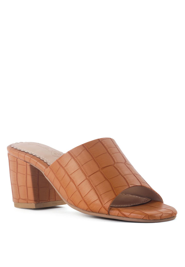 Dumpllin Croco Slip-On Block Heel Sandals featuring a stylish croc pattern and mid block heel design.