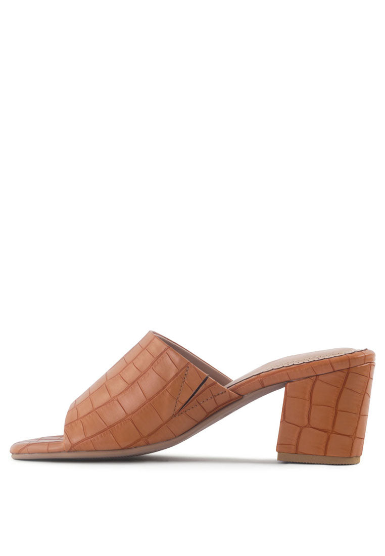 Dumpllin Croco Slip-On Block Heel Sandals featuring a stylish croc pattern and mid block heel design.