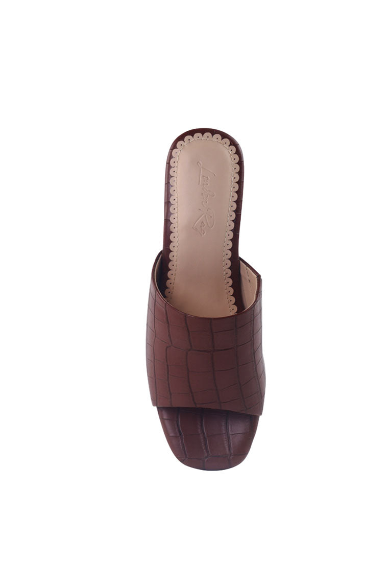 Dumpllin Croco Slip-On Block Heel Sandals featuring a stylish croc pattern and mid block heel design.