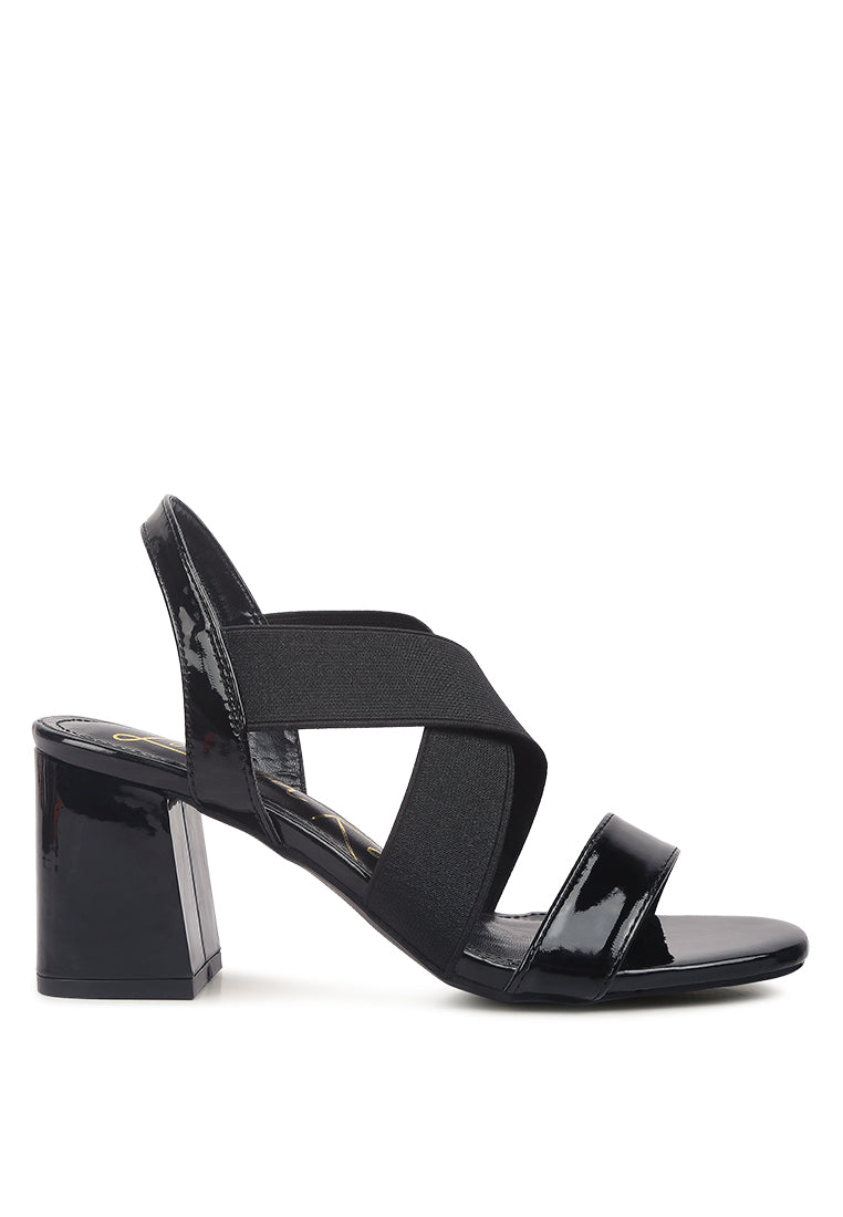 A pair of stylish Elastic Straps Block Heel Sandals featuring elastic straps, a block heel, and an open rounded toe design.