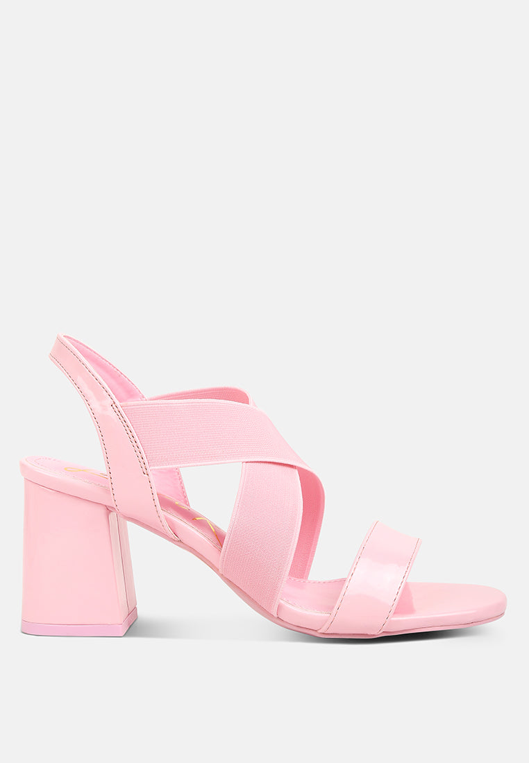 A pair of stylish Elastic Straps Block Heel Sandals featuring elastic straps, a block heel, and an open rounded toe design.