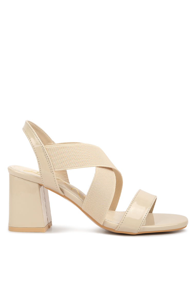 A pair of stylish Elastic Straps Block Heel Sandals featuring elastic straps, a block heel, and an open rounded toe design.