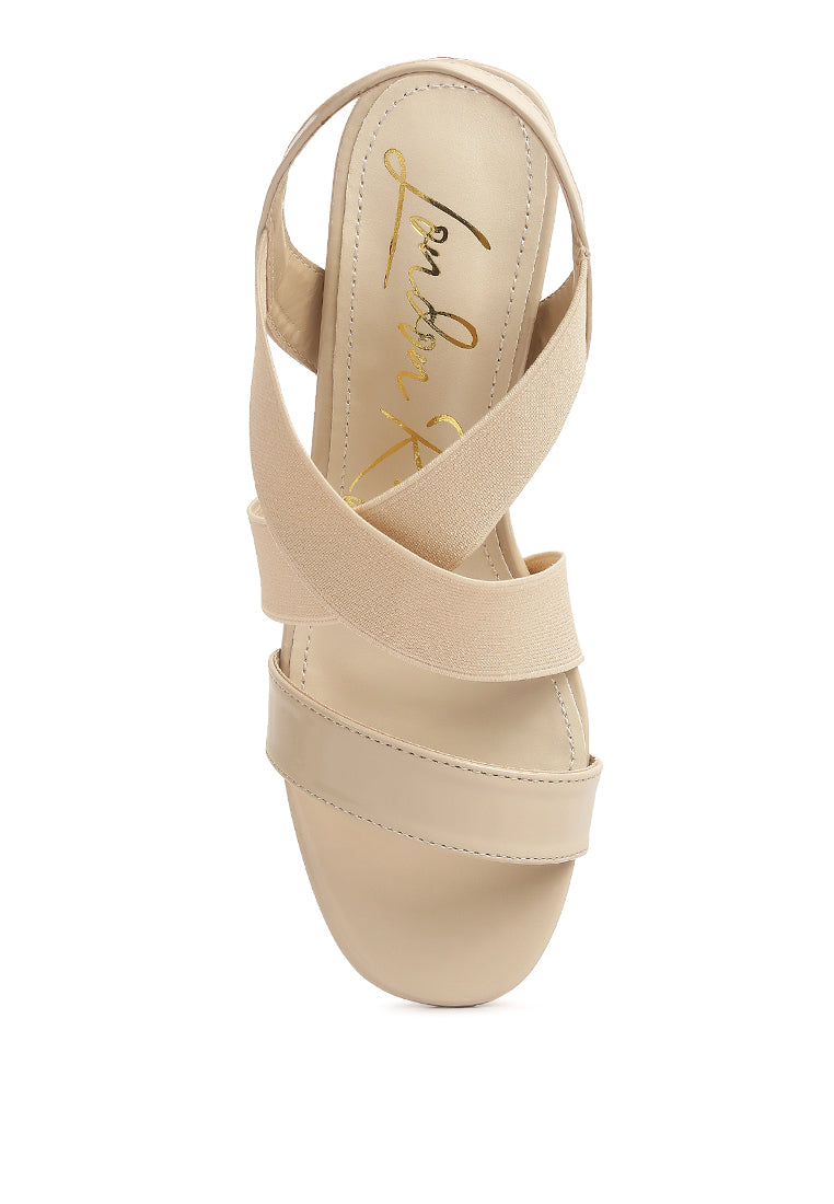 A pair of stylish Elastic Straps Block Heel Sandals featuring elastic straps, a block heel, and an open rounded toe design.