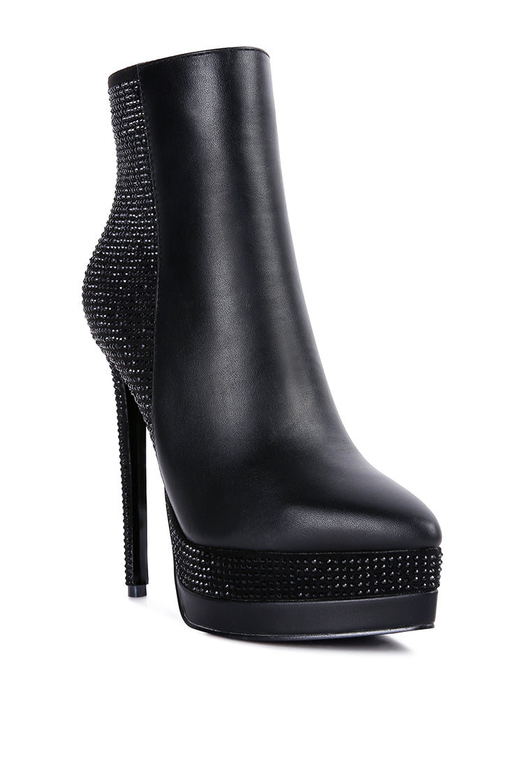 A pair of stylish Encanto High Heeled Ankle Boots featuring rhinestone details, closed pointed toe, and side zipper, perfect for glamorous outfits.