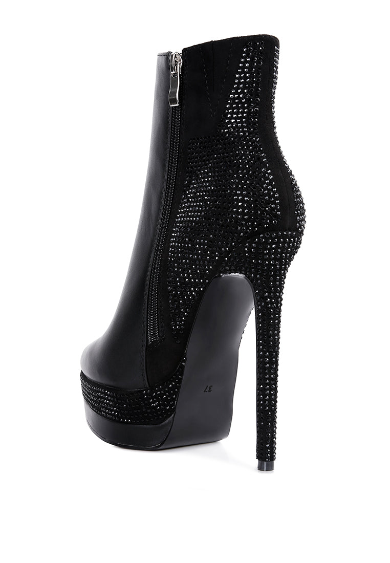 A pair of stylish Encanto High Heeled Ankle Boots featuring rhinestone details, closed pointed toe, and side zipper, perfect for glamorous outfits.