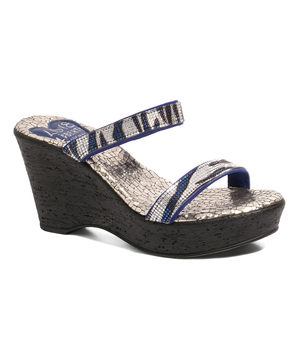 Encore statement wedges featuring snake print and rhinestone upper, perfect for stylish nights out.