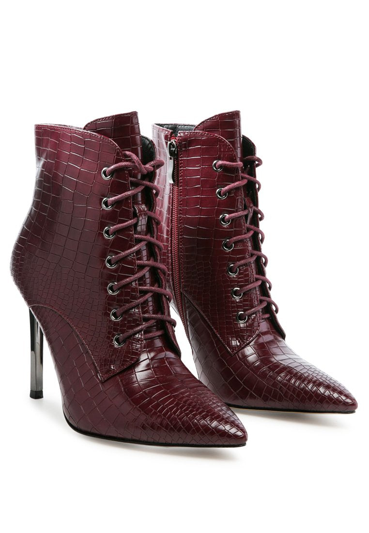 Escala Croc Stiletto Ankle Boots featuring a lace-up design and shiny stiletto heels, crafted from croc textured faux leather.