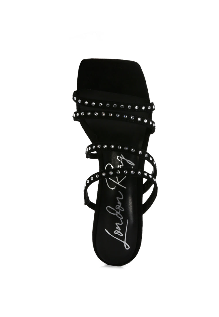 Face Me Studded Spool Heel Multi Strap Sandals featuring an open square toe and studded multi-strap design in various colors.