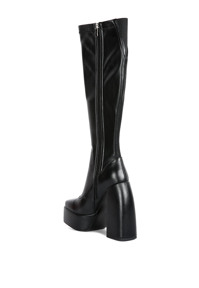 Fanning Platform Long Boots featuring a stylish design with a curved block heel, square toe, and side zipper, made from faux leather.