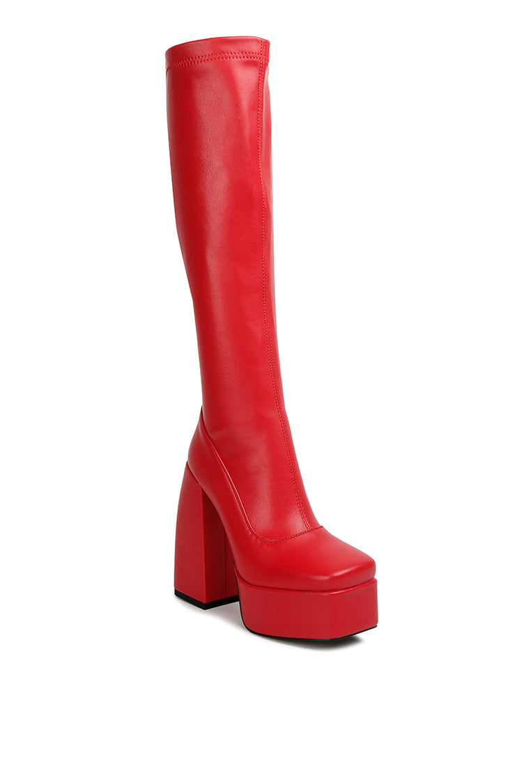 Fanning Platform Long Boots featuring a stylish design with a curved block heel, square toe, and side zipper, made from faux leather.