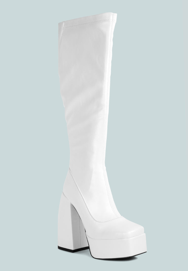 Fanning Platform Long Boots featuring a stylish design with a curved block heel, square toe, and side zipper, made from faux leather.