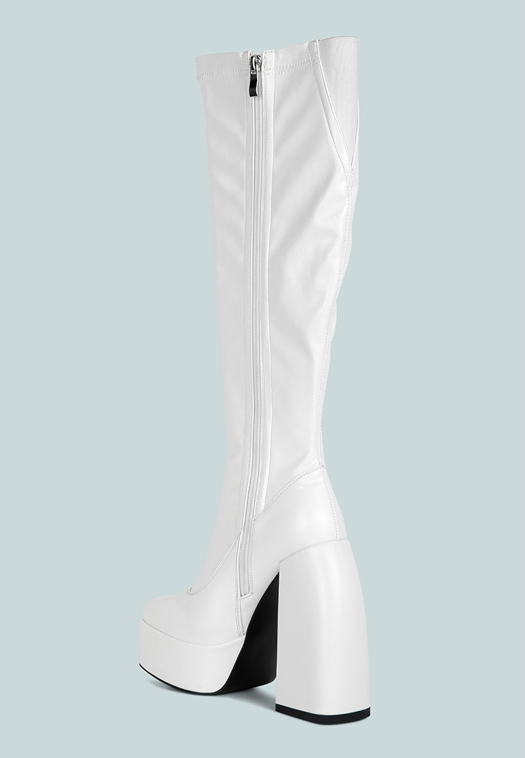 Fanning Platform Long Boots featuring a stylish design with a curved block heel, square toe, and side zipper, made from faux leather.