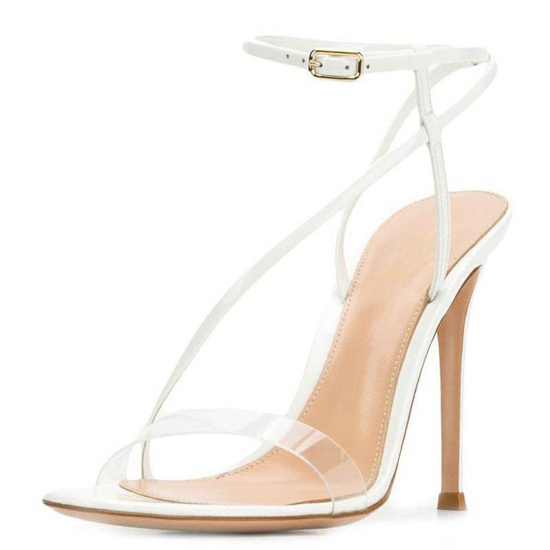 Fashion sandals featuring cross straps and thin heels, designed for women, showcasing a sleek patent leather finish.