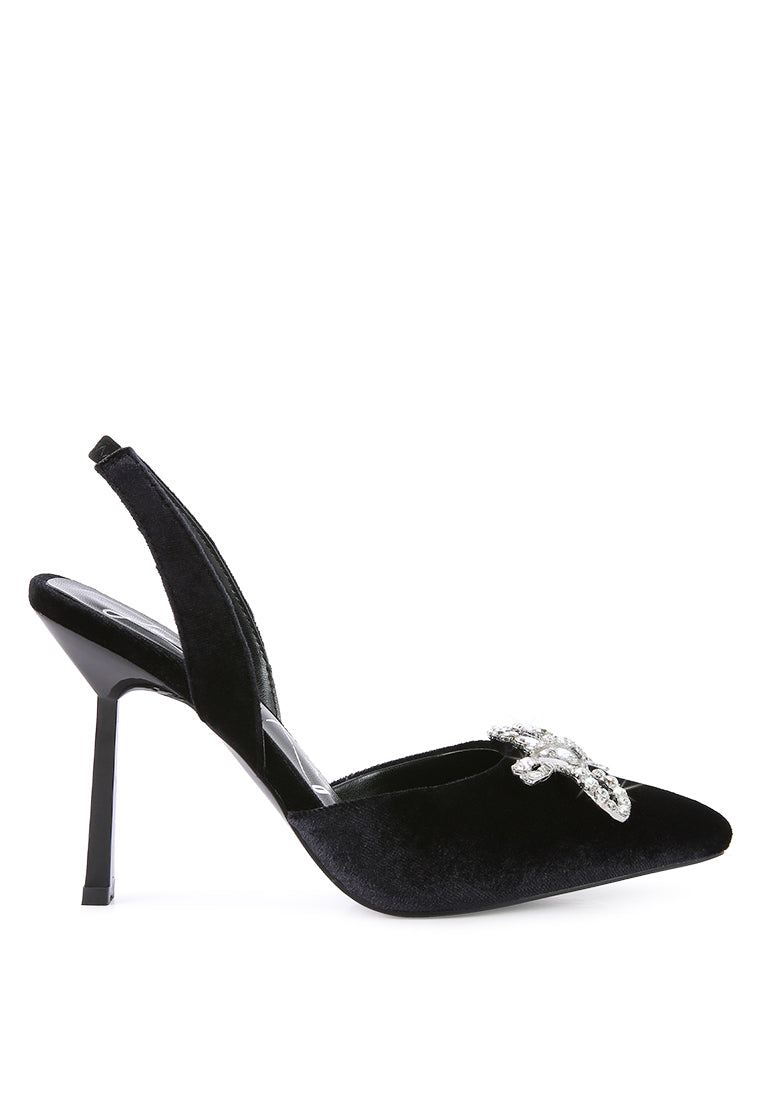 Firebird Pump high-heeled mules in luxurious velvet with a decorative diamante brooch, showcasing a closed pointed toe and elasticated slingback.