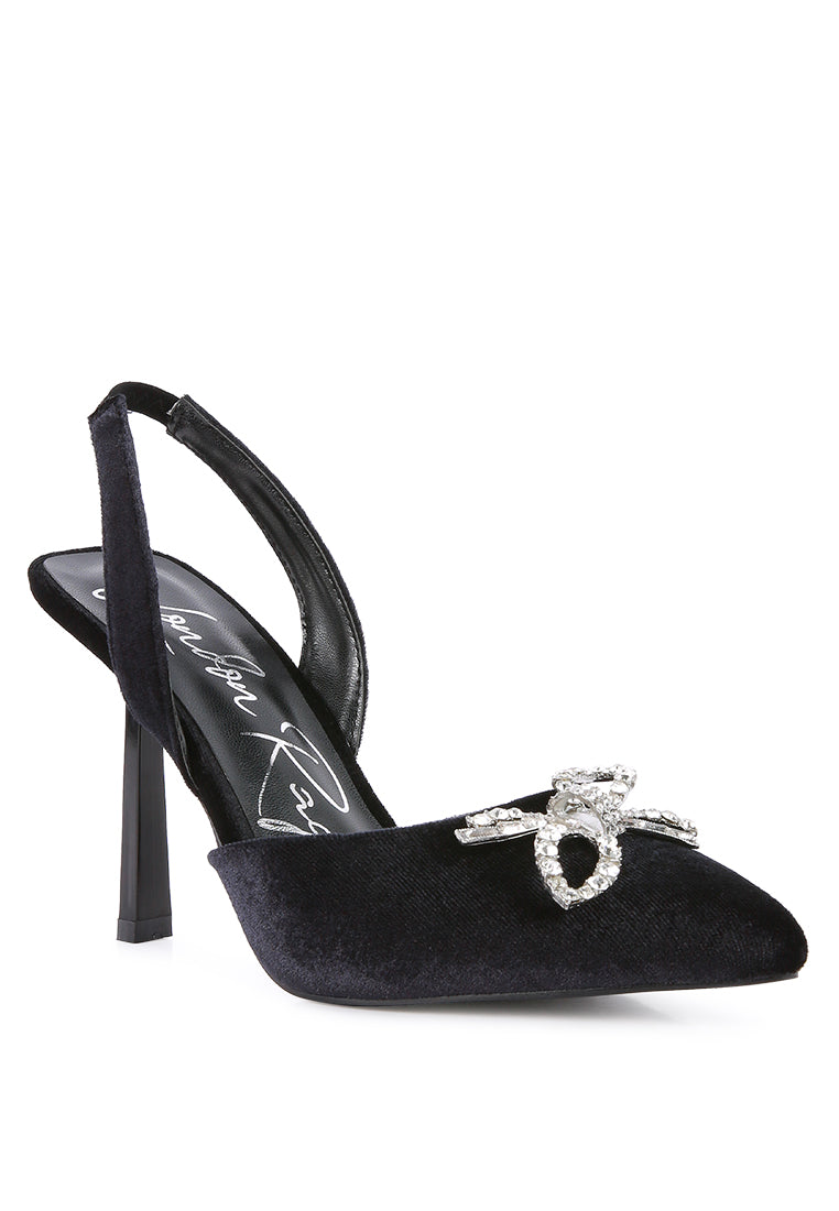 Firebird Pump high-heeled mules in luxurious velvet with a decorative diamante brooch, showcasing a closed pointed toe and elasticated slingback.