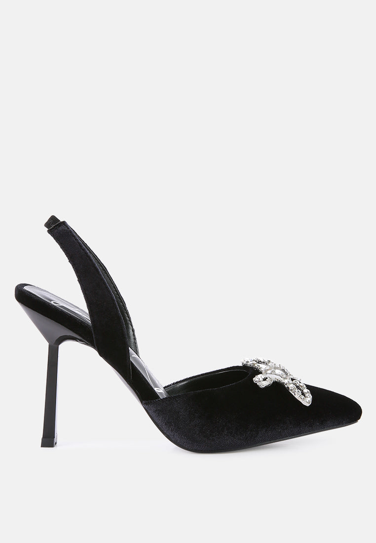 Firebird Pump high-heeled mules in luxurious velvet with a decorative diamante brooch, showcasing a closed pointed toe and elasticated slingback.