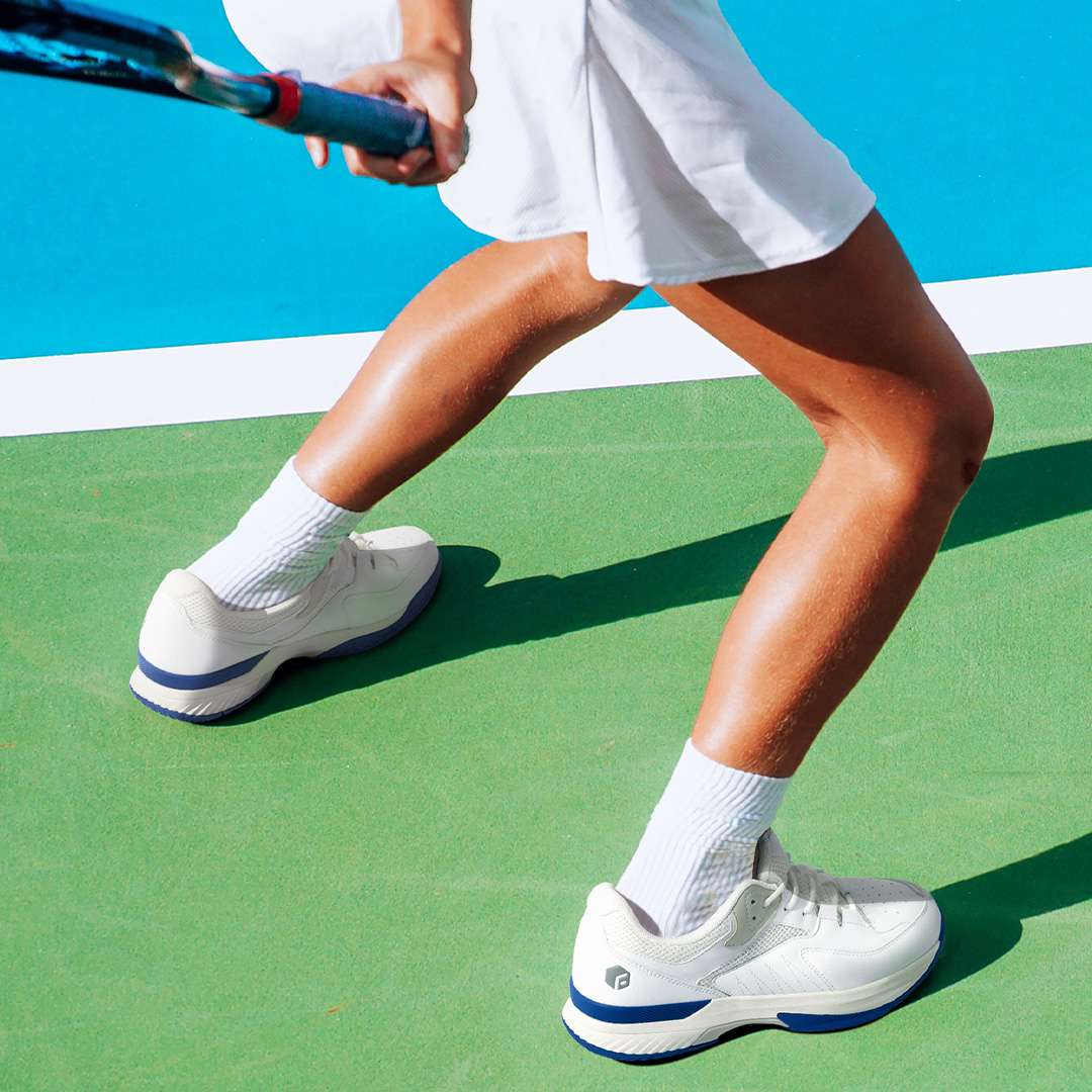 FitVille Women's Court Tennis Amadeus V1 shoes in black, white, orange, and khaki colorways, showcasing their stylish design and breathable upper.