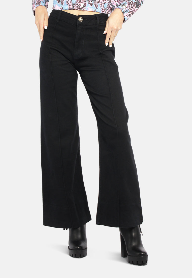 A pair of stylish women's flared pants made from 100% cotton, featuring a high-rise waist, wide leg design, and multiple functional pockets.