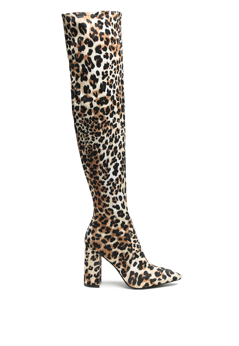 Flittle Over-The-Knee Boots featuring a stylish design with a block heel and pointed toe, made from faux leather.