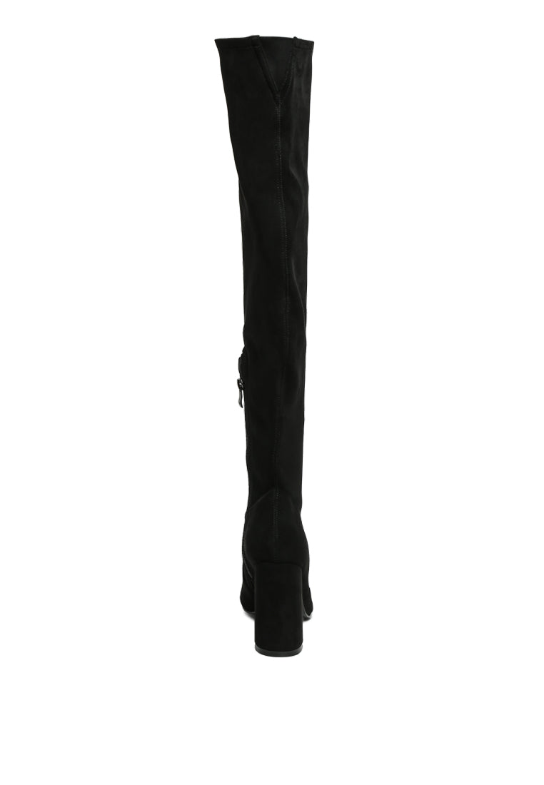 Flittle Over-The-Knee Boots featuring a stylish design with a block heel and pointed toe, made from faux leather.