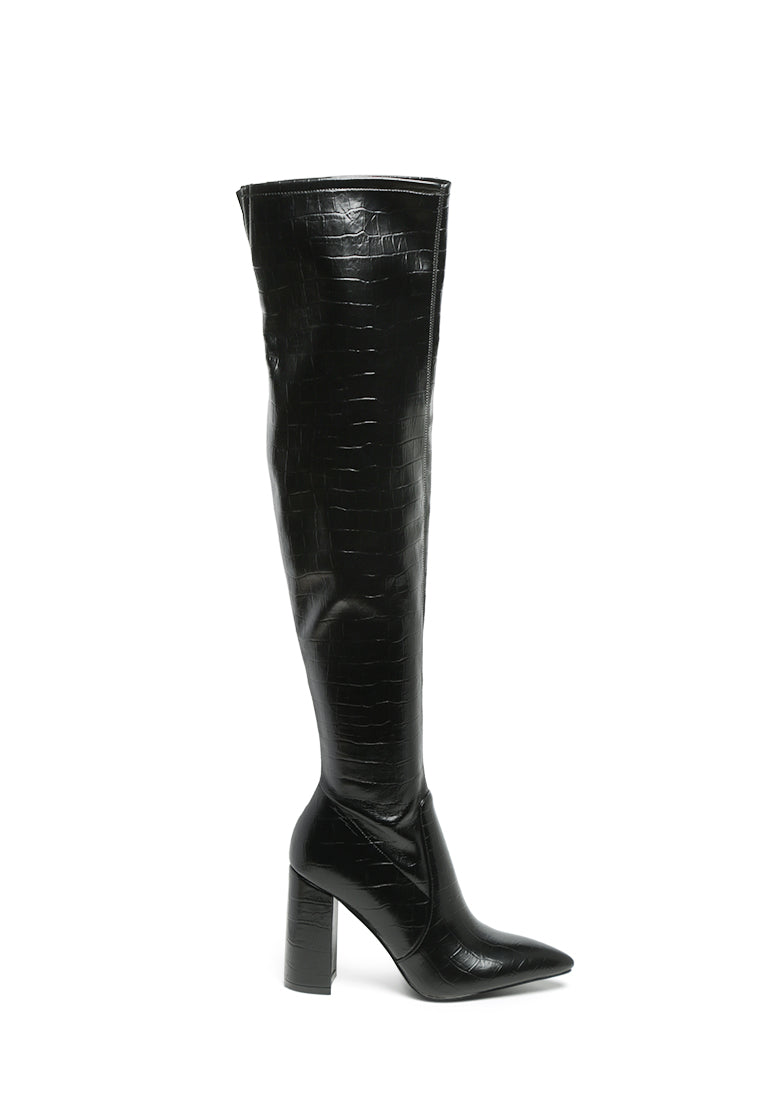 Flittle Over-The-Knee Boots featuring a stylish design with a block heel and pointed toe, made from faux leather.