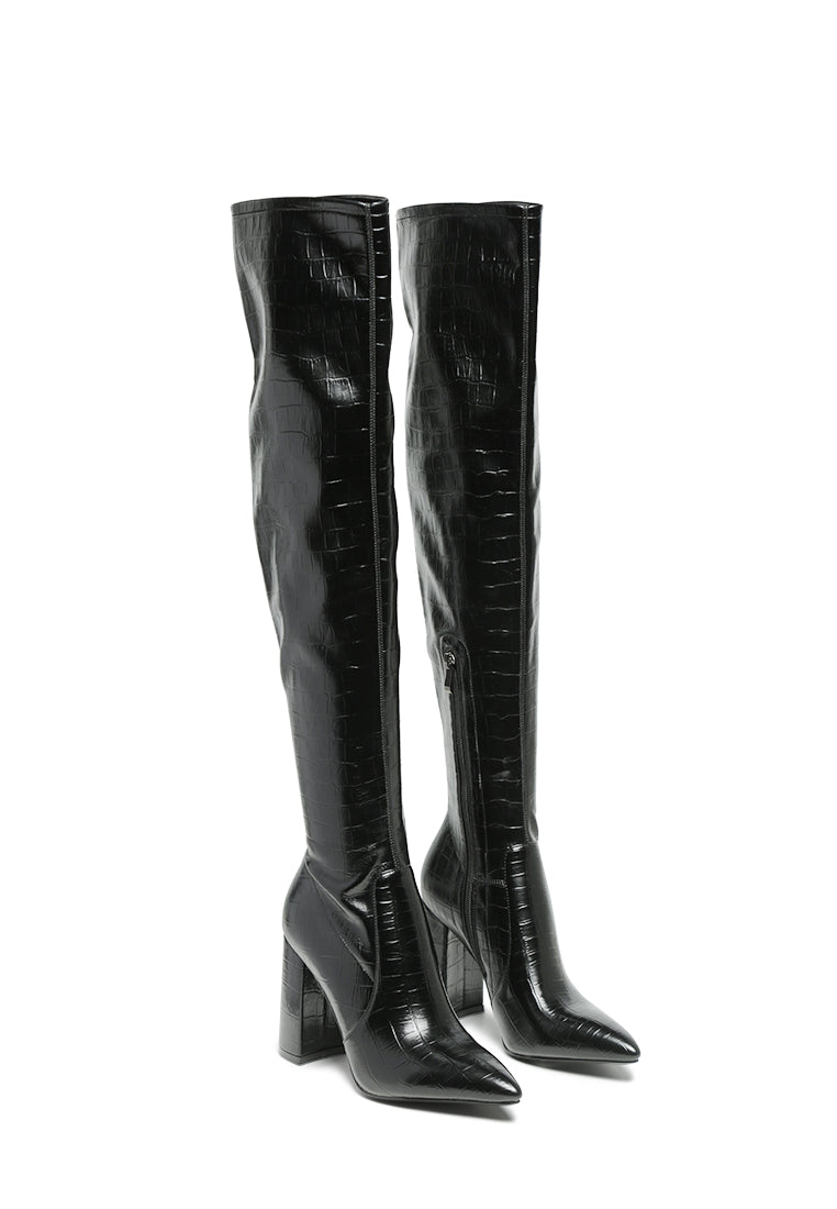 Flittle Over-The-Knee Boots featuring a stylish design with a block heel and pointed toe, made from faux leather.