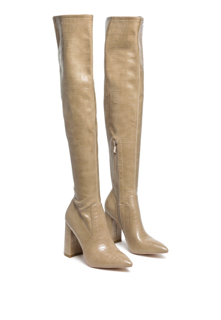 Flittle Over-The-Knee Boots featuring a stylish design with a block heel and pointed toe, made from faux leather.