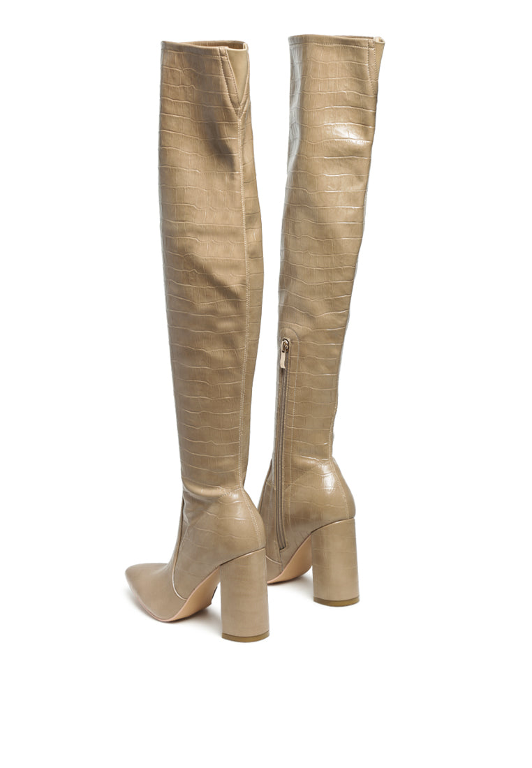 Flittle Over-The-Knee Boots featuring a stylish design with a block heel and pointed toe, made from faux leather.