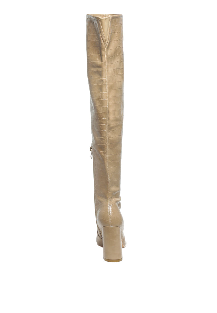 Flittle Over-The-Knee Boots featuring a stylish design with a block heel and pointed toe, made from faux leather.