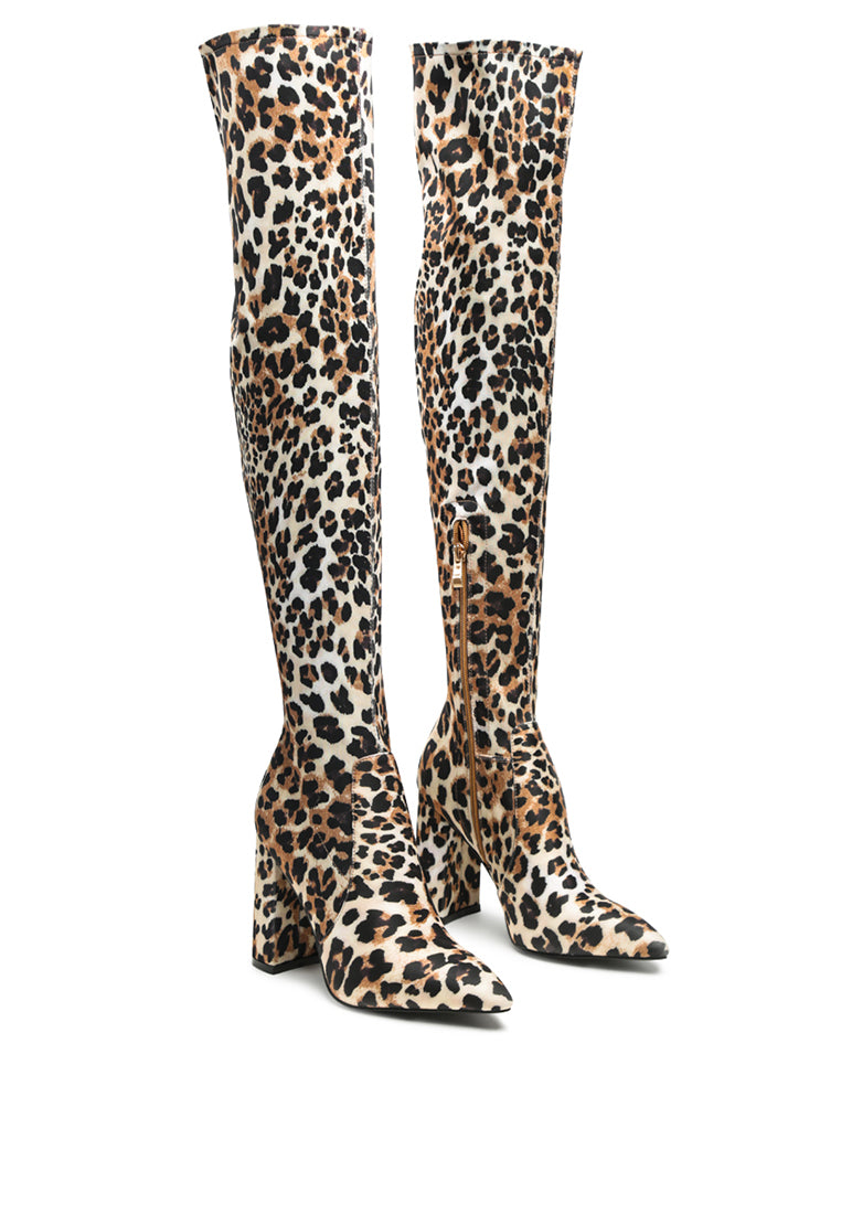 Flittle Over-The-Knee Boots featuring a stylish design with a block heel and pointed toe, made from faux leather.