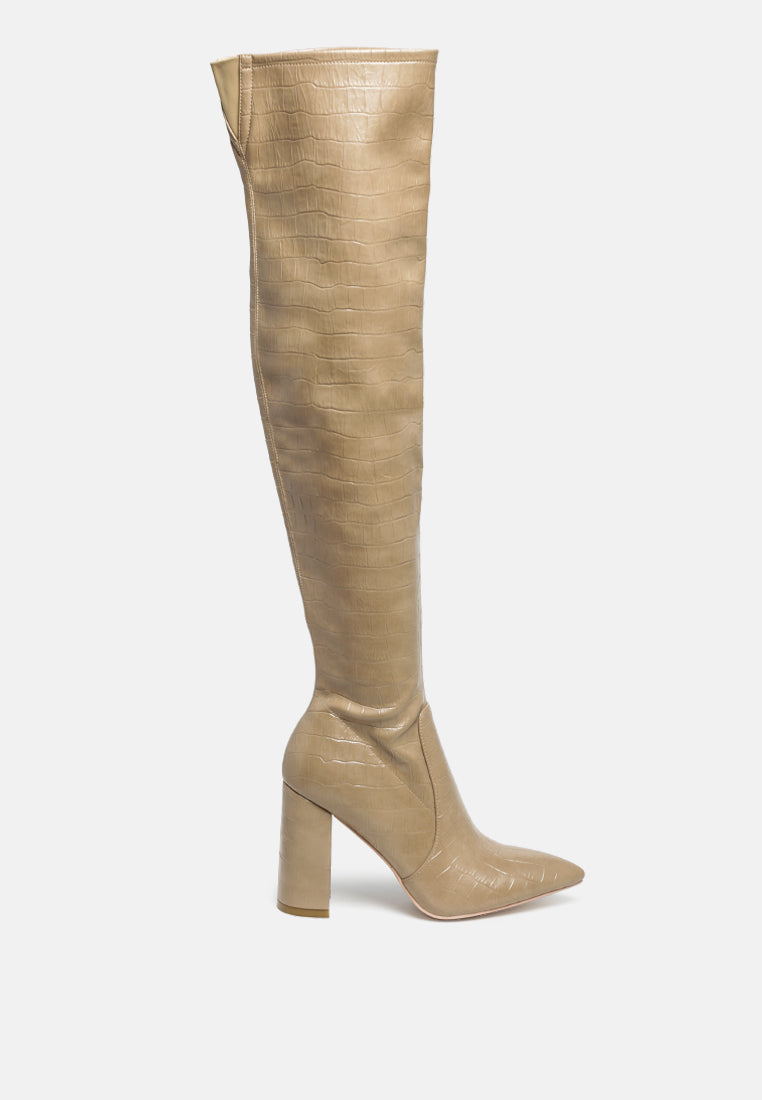 Flittle Over-The-Knee Boots featuring a stylish design with a block heel and pointed toe, made from faux leather.