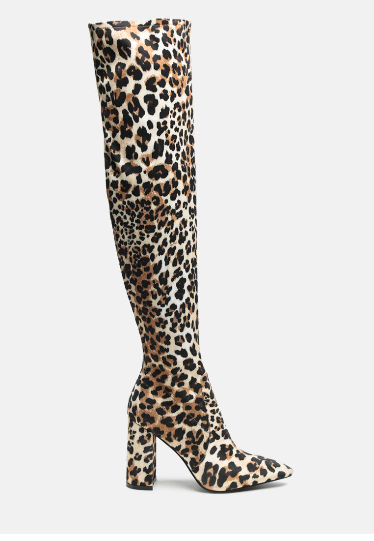 Flittle Over-The-Knee Boots featuring a stylish design with a block heel and pointed toe, made from faux leather.