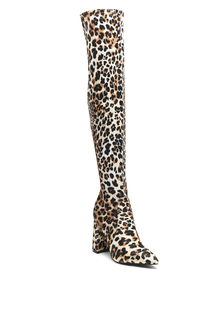 Flittle Over-The-Knee Boots featuring a stylish design with a block heel and pointed toe, made from faux leather.