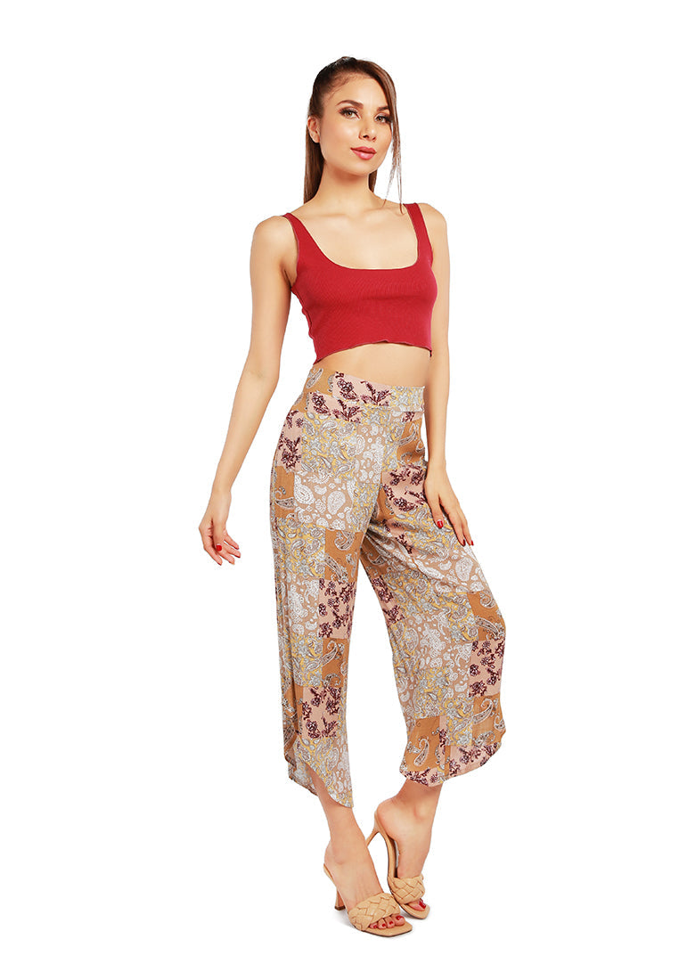 Floral Patchwork Print Pants featuring an asymmetrical hemline and vibrant floral designs, made from lightweight rayon fabric.