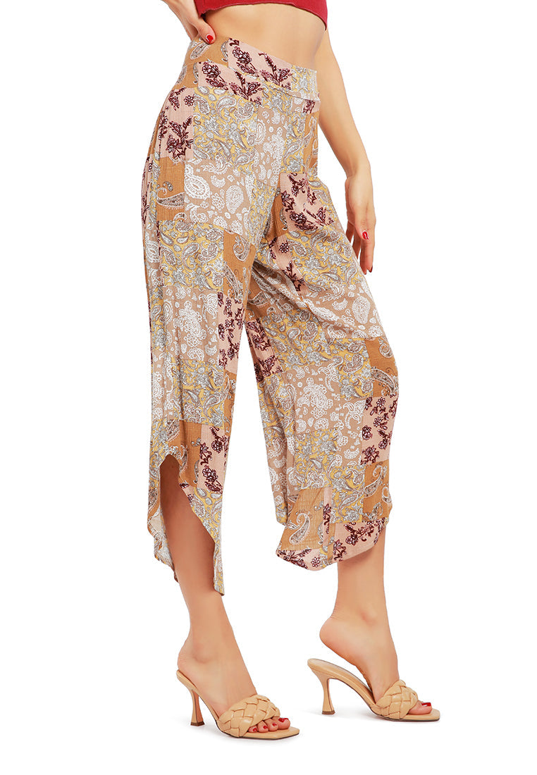 Floral Patchwork Print Pants featuring an asymmetrical hemline and vibrant floral designs, made from lightweight rayon fabric.